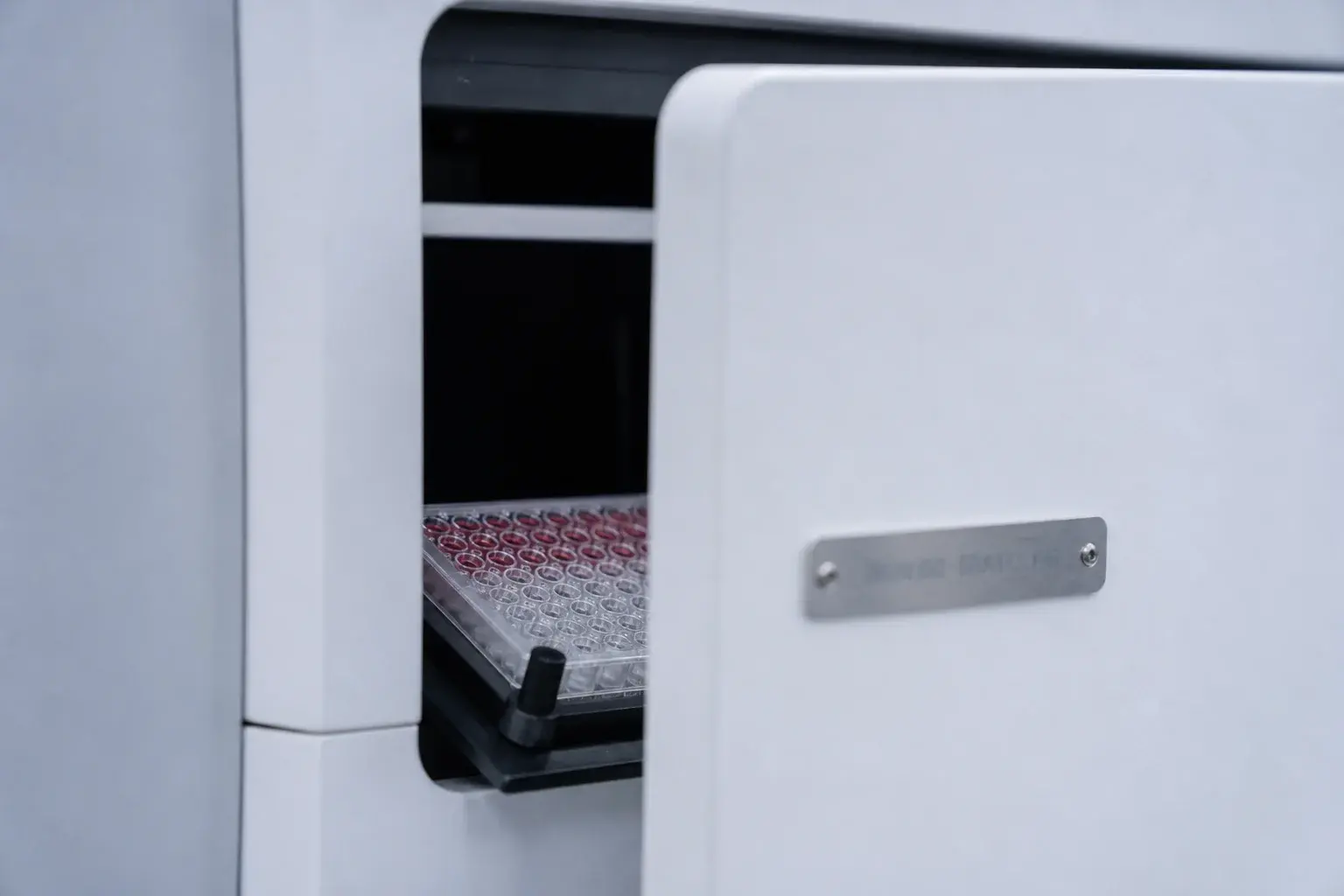The instrument door, closed over a plate still on the deck.