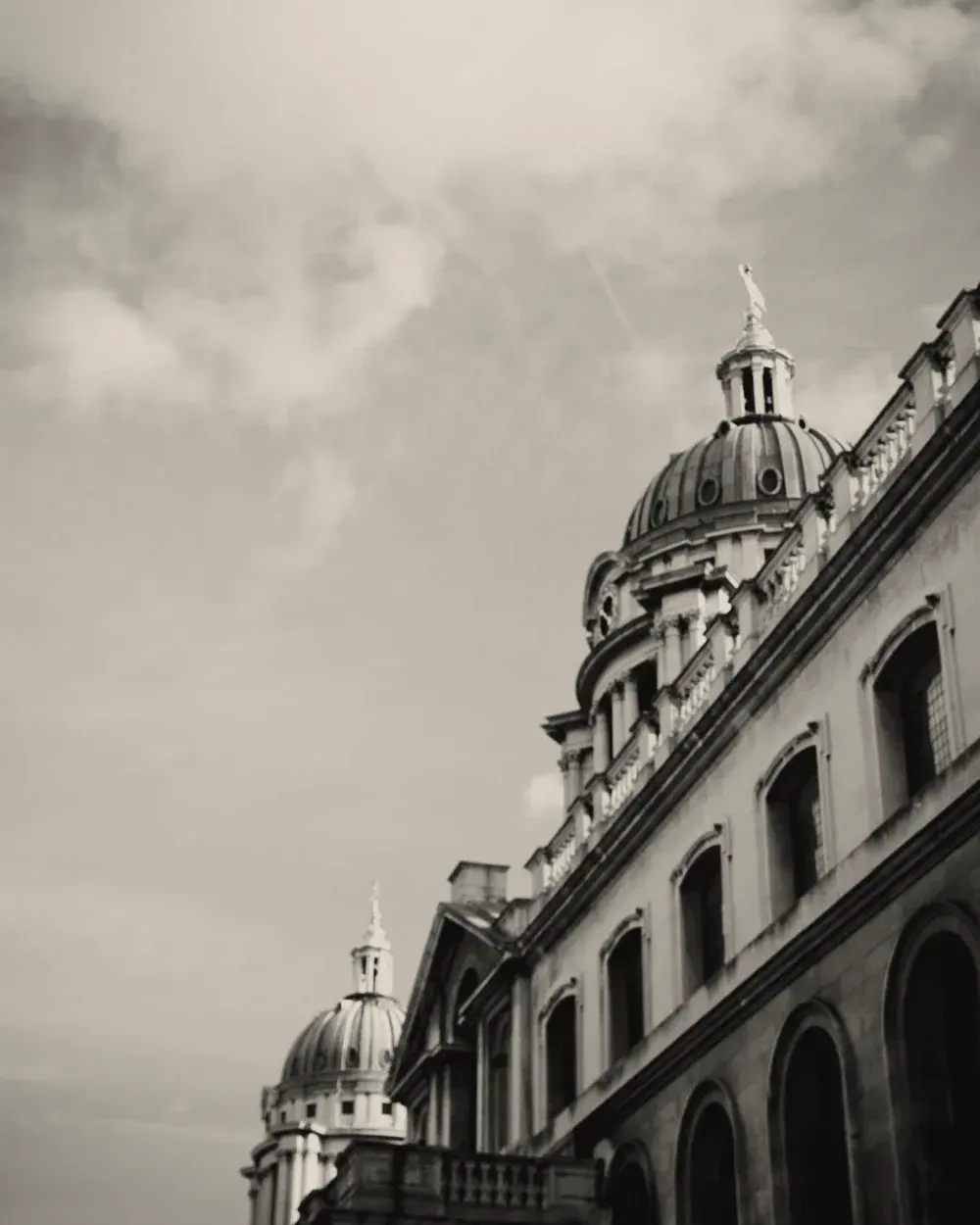 The facade of a foundry's offices, domed and columned.