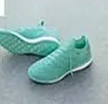 A pair of deep teal boots on a concrete floor