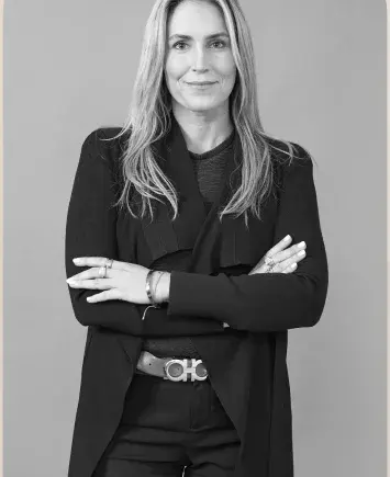 Portrait of a lawyer with folded arms, in black and white.