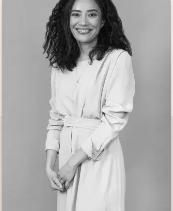 Portrait of a lawyer in a pale dress, in black and white.