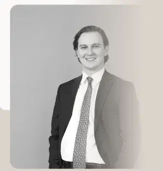 Portrait of a lawyer in a suit and tie, in black and white.