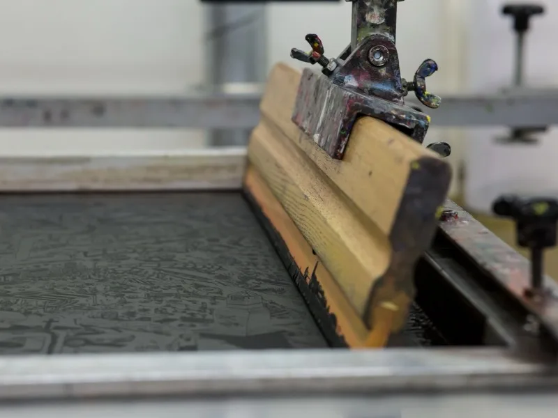 A letterpress bed with a forme locked up and ready to run.